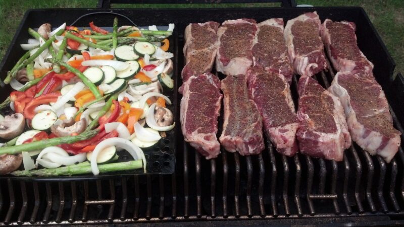 steak and veggies on the grill